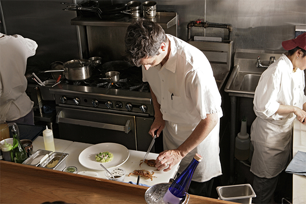 Drug testing services protect your employees. Here, a chef wields a knife.