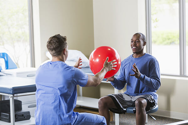 Post Injury Physicals Man With Therapy Ball