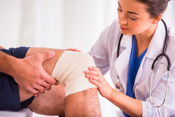 Treating Your Injuries Wrapped Knee Exam