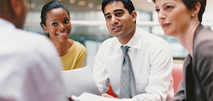 Group of business men and women collaborating