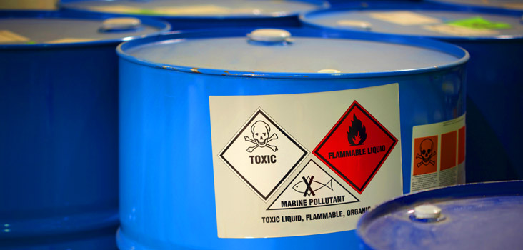 Barrels of chemicals representing why medical surveillance is needed for companies