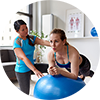 Women and trainer in a workout session 