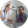 Doctor walking patient through a pre-placement exam.